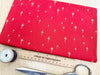 Christmas Fabric - Gold Glitter Stars on Red - Cotton Fabric