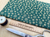 Christmas Fabric - Gold Snowflakes on Green - Cotton Fabric