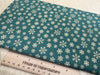 Christmas Fabric - Gold Snowflakes on Green - Cotton Fabric